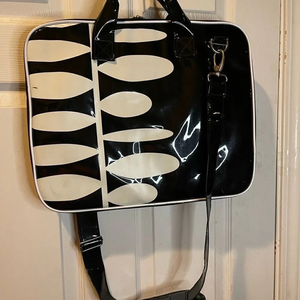 Black and white padded laptop bag with detachable padded shoulder strap